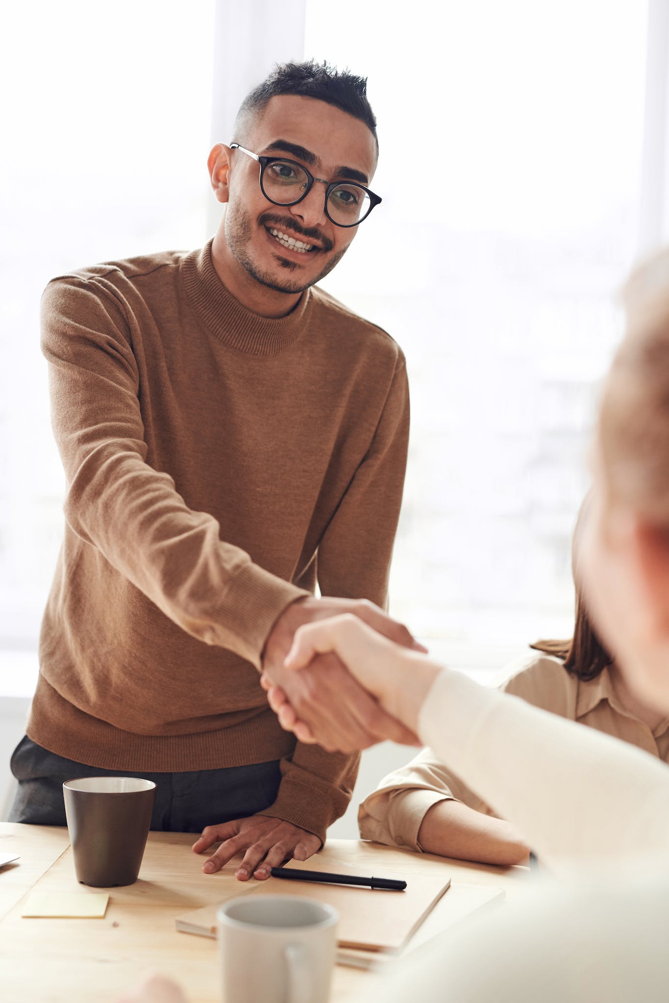 Photo Of Man Wearing Brown Sweater